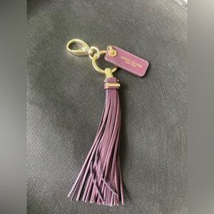 NWOT Henri Bendel Purple/plum color tassel key fob/bag charm